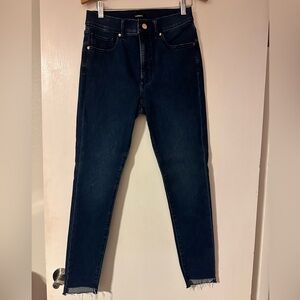 These Express women's dark blue skinny jeans feature a mid-rise fit.